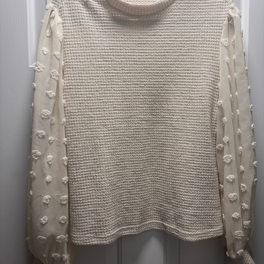 Elegant Cream Sweater with Textured Sleeves